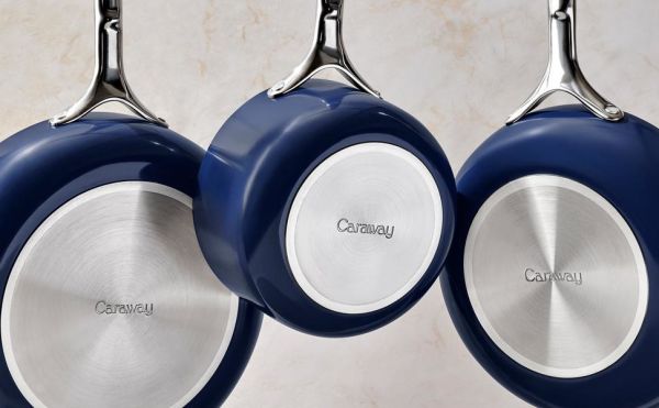 Caraway Cookware Pans Hanging from Rack
