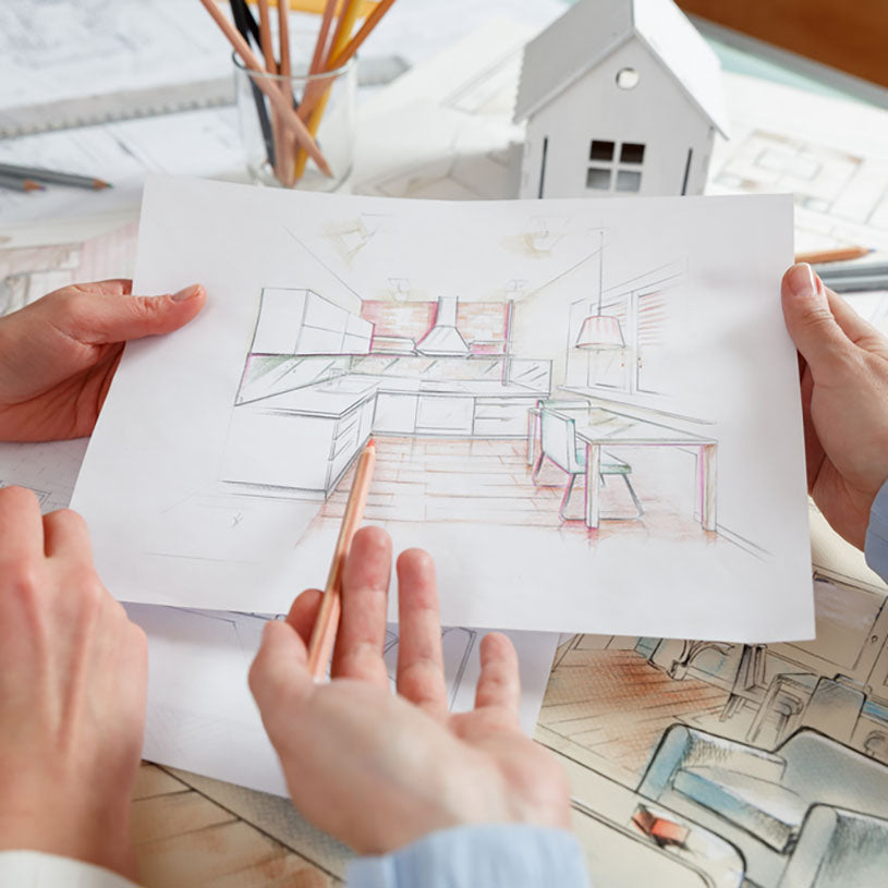 couple looking at home blueprint