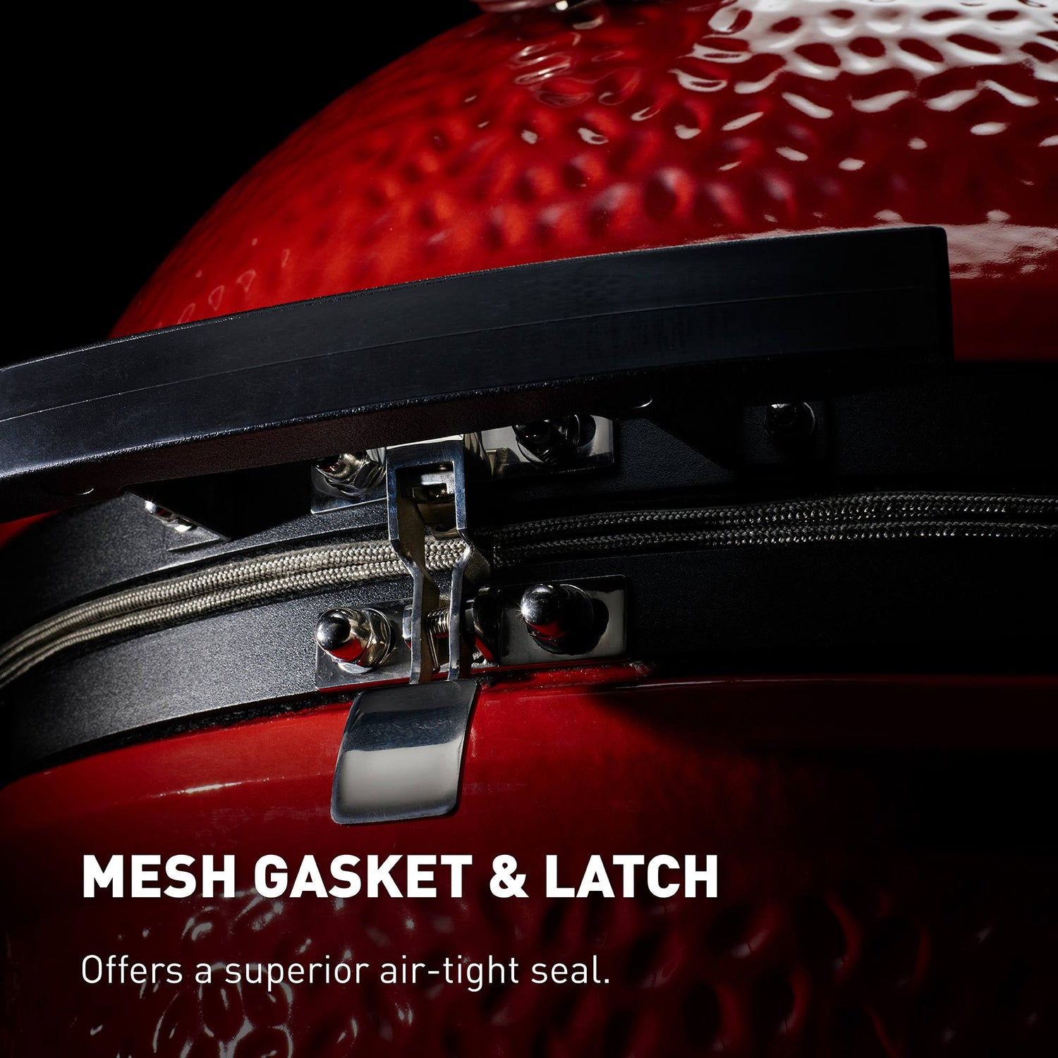 Close-up of a red container with a mesh gasket and latch, highlighting the sealing mechanism.