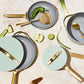 Caraway Non-Toxic and Non-Stick Cookware Set in Silt Green with Gold Handles