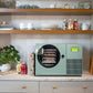 Harvest Right Countertop 360 sage green freeze dryer in a kitchen
