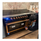 ILVE Nostalgie II 48-Inch Induction Range with 6 Induction Elements, 5.02 cu. ft. Oven, Glossy Black with Copper Trim, Solid Door, UNI486QNMPBKP