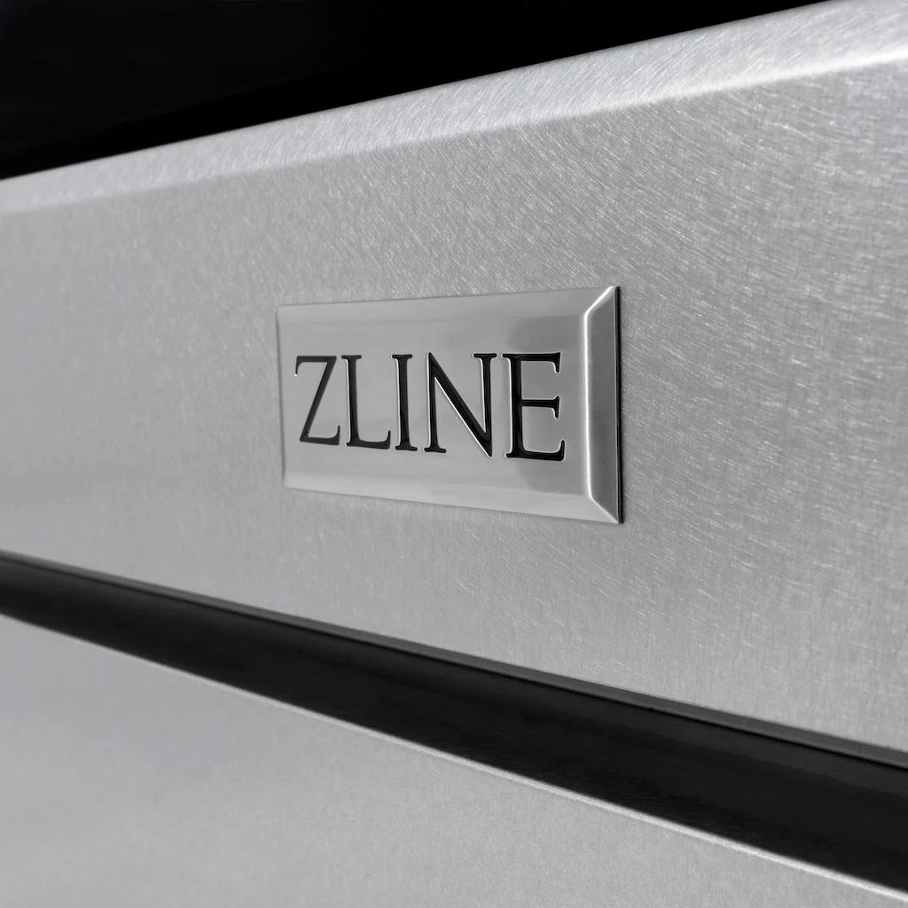 Close-up view of the ZLINE logo badge on the front of a gas range in DuraSnow stainless steel, showcasing the detailed texture and finish of the appliance