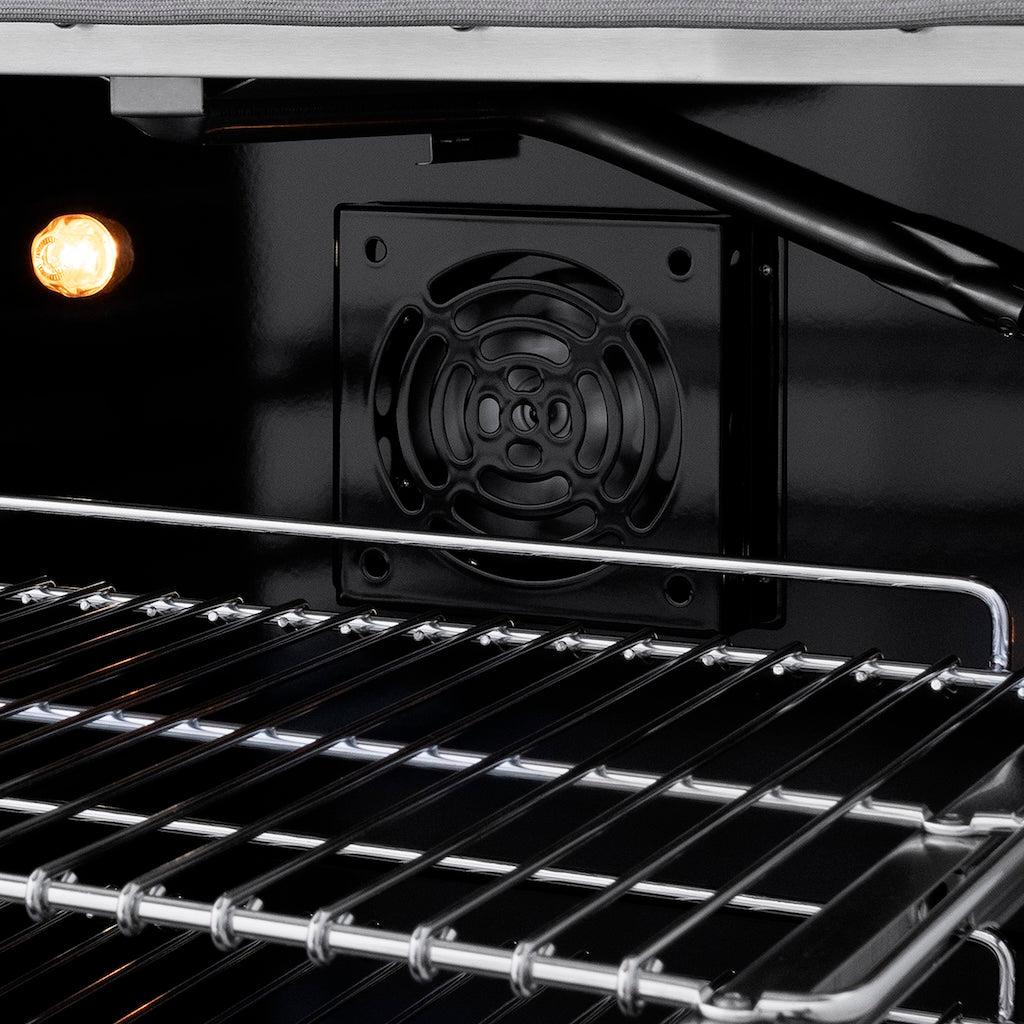 Interior view of a ZLINE convection gas oven, showing a lit oven light and a detailed look at the fan used for circulating heat. The sturdy oven racks and the sleek black interior highlight the oven's design and functionality for consistent cooking results