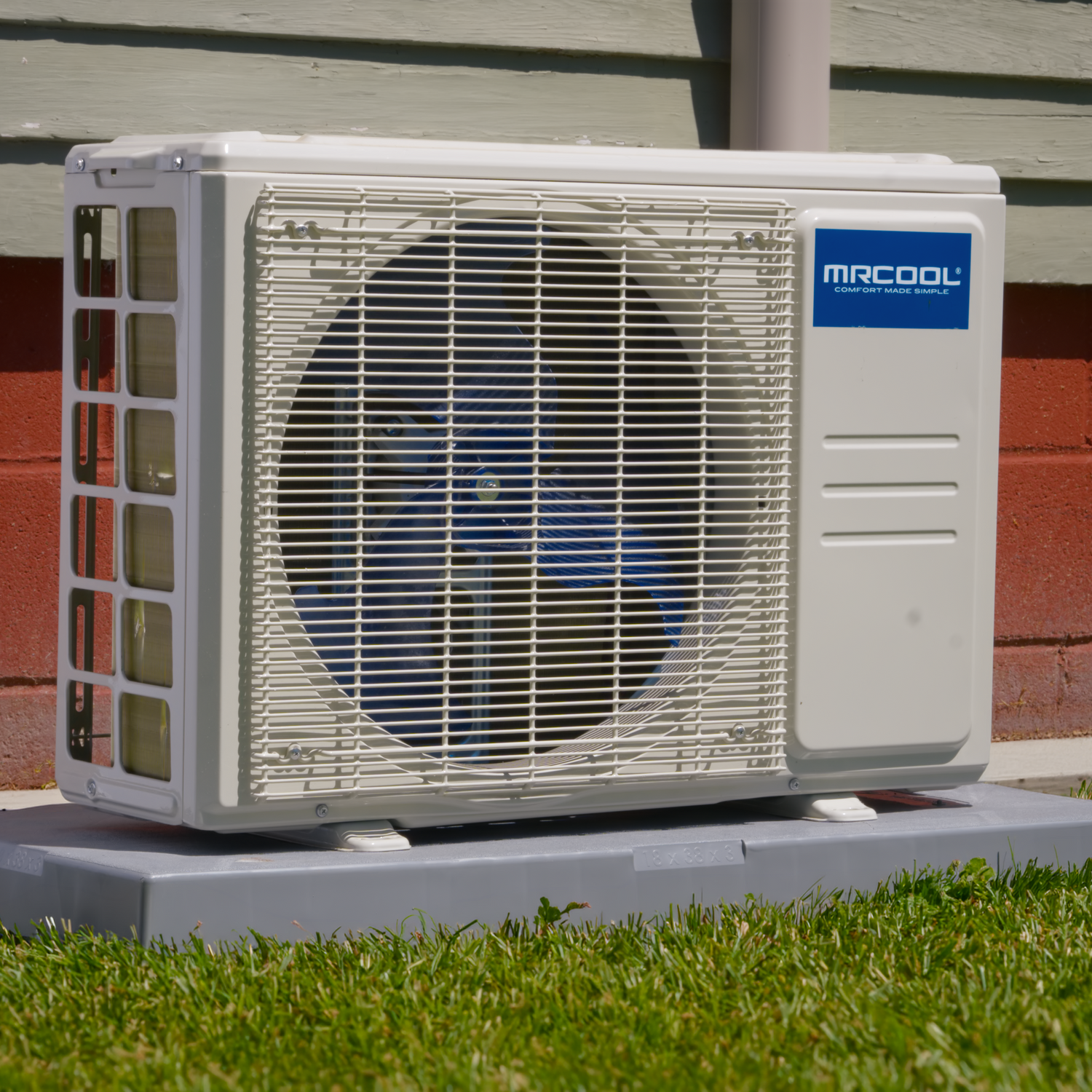 Air conditioning unit with Microl air conditioner logo on a grassy area.