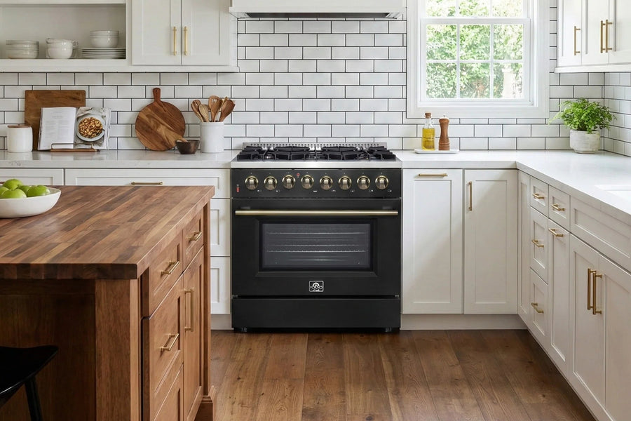 Modern kitchen with black stove, wooden island, and white cabinets.