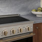 ZLINE Autograph 24 in. 3.2 cu. ft. Marino Induction Range with 3 Element Cooktop and Electric Convection Oven in Satin Stainless Steel with Champagne Bronze Accents, MINRSZ-24-CB - Lifestyle Photo 3