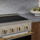 ZLINE Autograph 24 in. 3.2 cu. ft. Marino Induction Range with 3 Element Cooktop and Electric Convection Oven in Satin Stainless Steel with White Matte Door and Polished Gold Accents, MINRSZ-WM-24-G - Lifestyle Photo 3