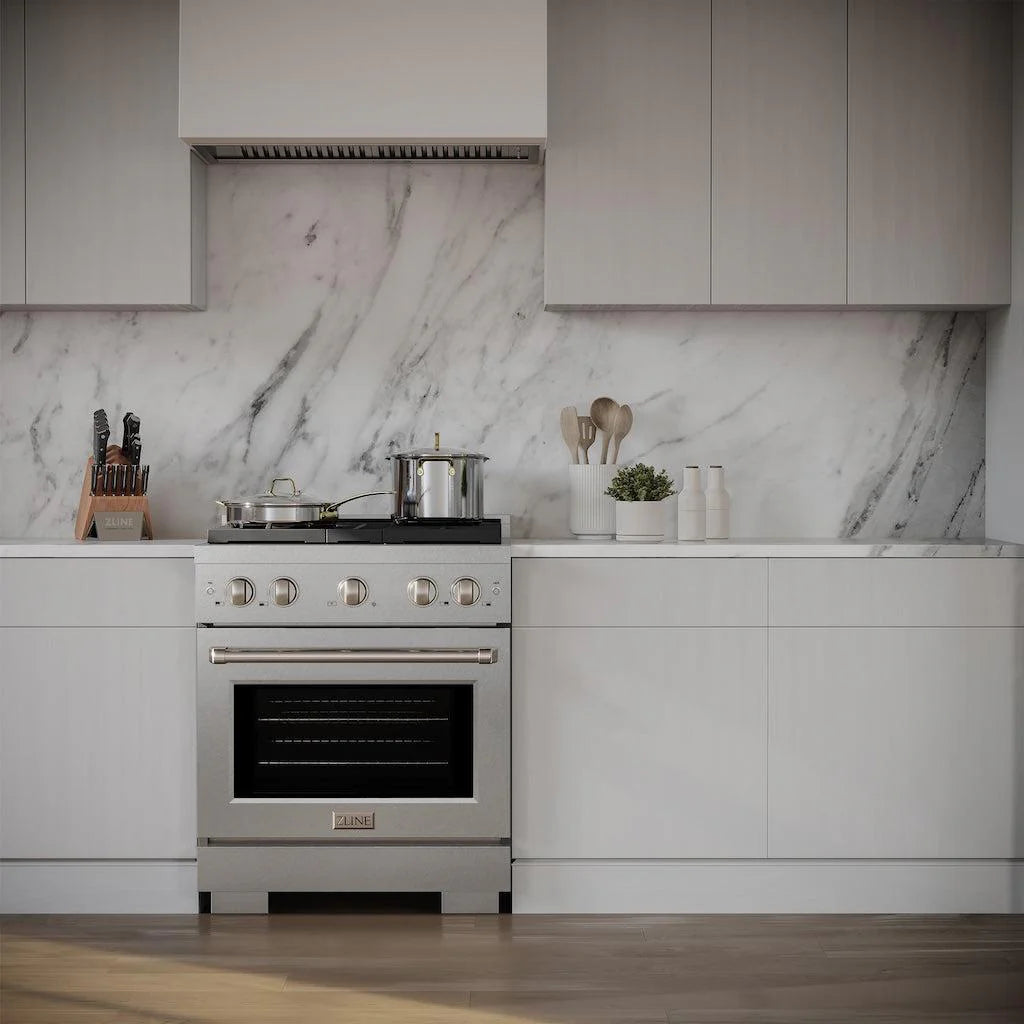 ZLINE 30-inch 4 Burner Gas Range with Convection Gas Oven in DuraSnow® Stainless Steel, installed in a modern kitchen with marble backsplash and white cabinetry, featuring cookware on the stove and kitchen utensils on the countertop.