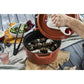 Staub 7 Qt. Cast Iron Round Dutch Oven in Burnt Orange