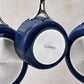 Caraway Cookware Pans Hanging from Rack
