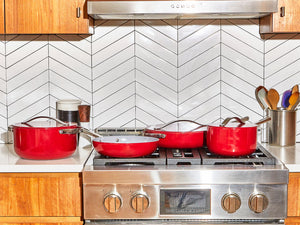 Caraway Red Cookware Set on Kitchen Range
