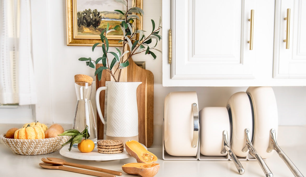 Caraway Cream Cookware Set on Kitchen Counter
