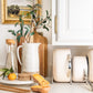 Caraway Cream Cookware Set on Kitchen Counter