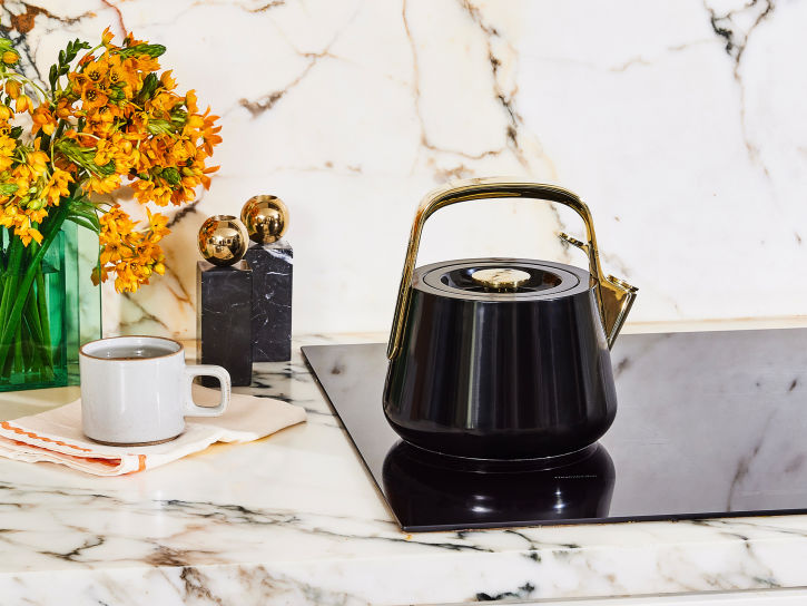 Caraway Whistling Tea Kettle in Black with Gold Accents