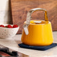 Caraway Whistling Tea Kettle in Marigold