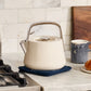 Caraway Whistling Tea Kettle in Cream